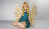 Hand painted ceramic sitting down fairy